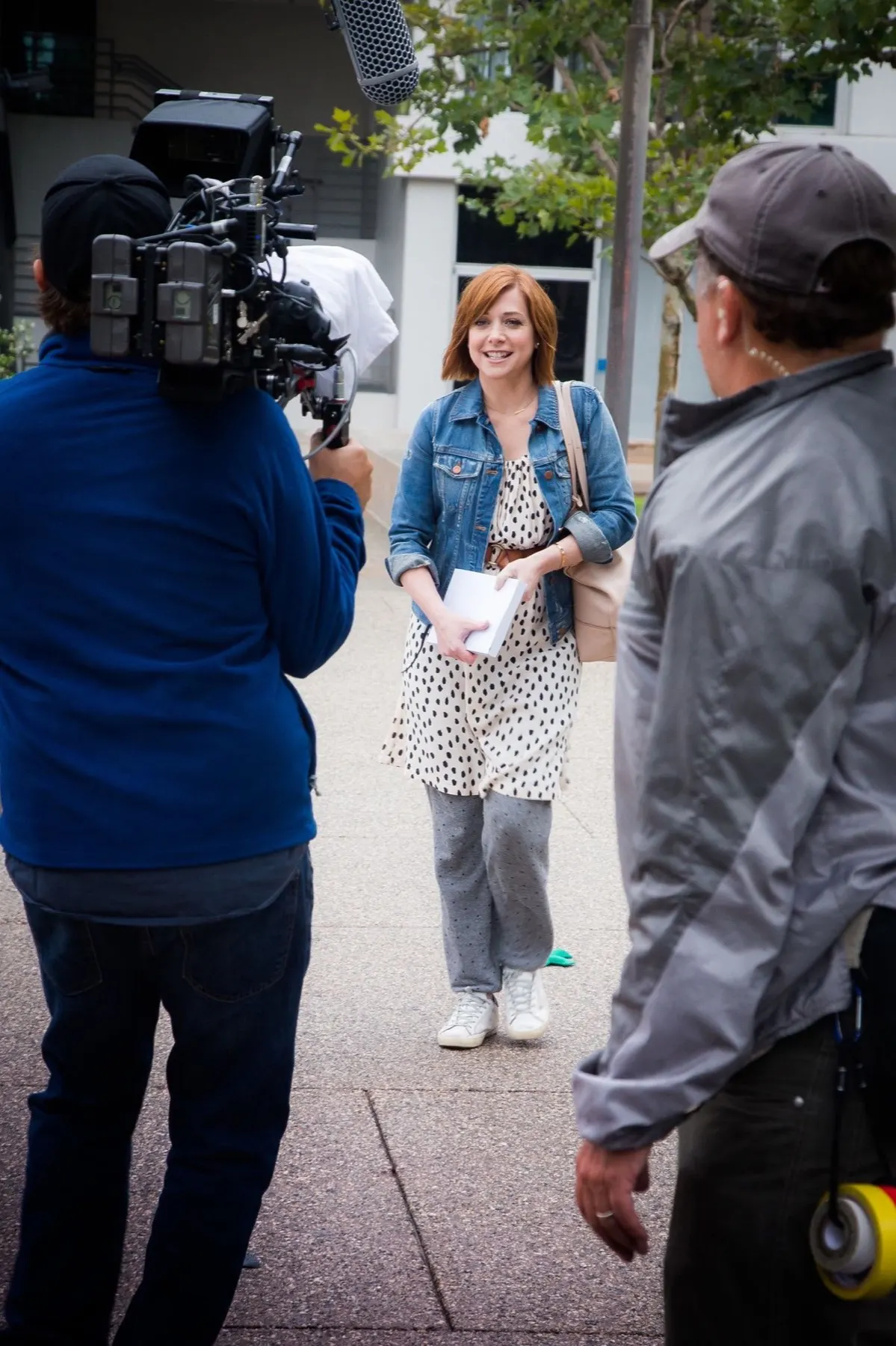 Camera operator framing Alyson Hannigan on the downtown Los Angeles location